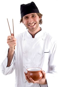 happy chef holding bowl and chopsticks on an isolated background