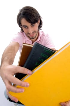 smiling male showing books with white background