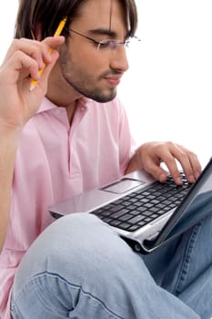 young man working on laptop on an isolated background