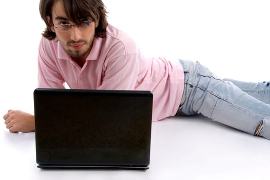 laying man with laptop on an isolated white background