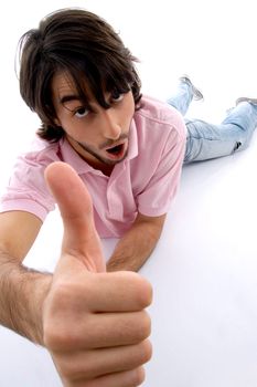 laying man wishing goodluck on an isolated white background