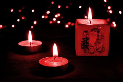 Christmas candle light in red tones