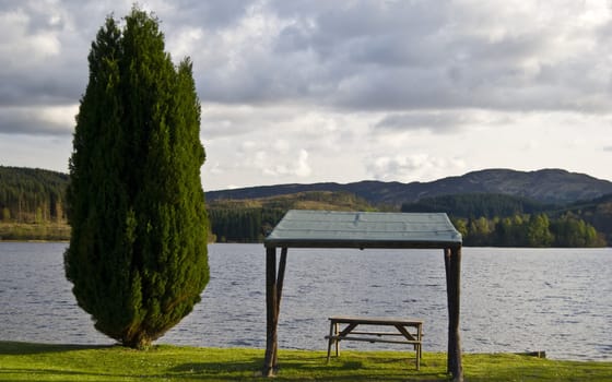 picnic table with a beautiful view over a lake