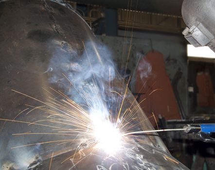 Factory Worker Welding a tank