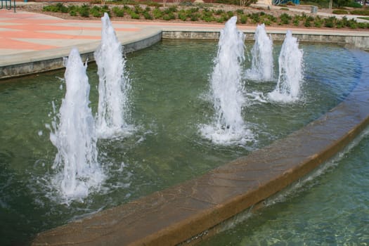 Water fountains in a downtown of a city.
