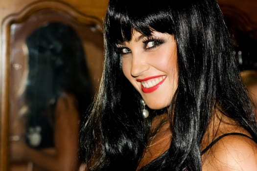 Beautiful helloween brunette girl in wig smiling