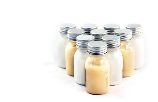 Bottles with shampoo, conditioner, and body lotion