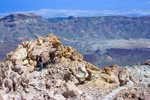 Girl standing on the top of the volcano