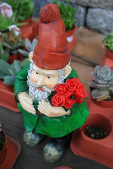 Close up of a small garden gnome.
