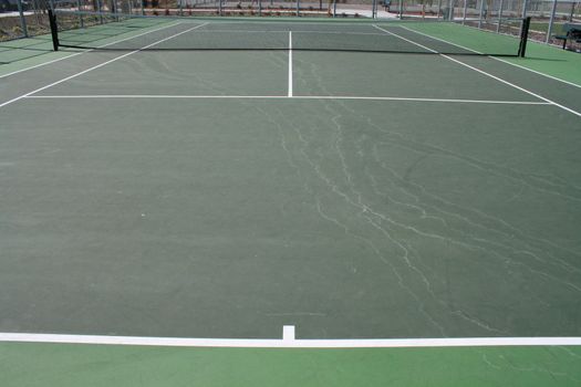 Tennis court during day time in a park.
