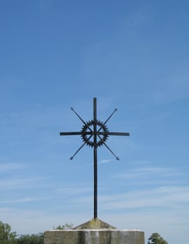 metal cross and blue sky
