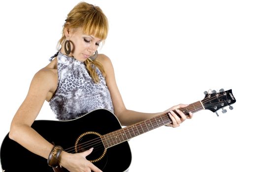 Young Ukrainian girl, holding and playing guitar. Pretty musician portrait.