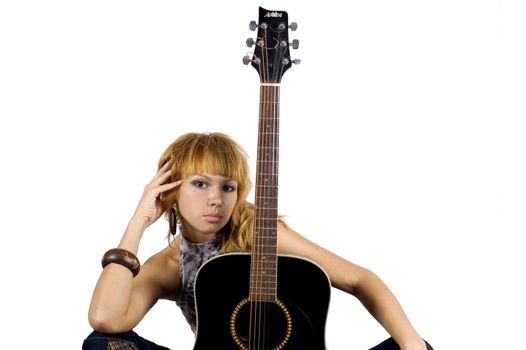 Pretty, blonde girl holding guitar, happy musician in country style.