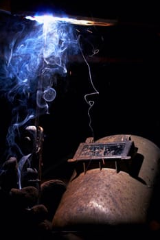 a picture of a welder working at night