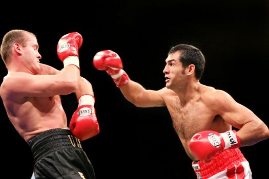  Argentinean Julio Cesar Dominguez (18-4-1, 12 KOs) is on the attack against defending WBA #8 light heavyweighter Vyacheslav Uzelkov (18-0, 11 KOs)  during their bout for the WBA light heavyweight Intercontinental Champion title at the Sports Palace Thursday, Feb 21, 2008 in Kyiv.