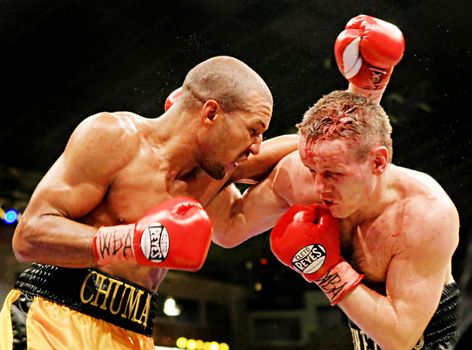 WBA interim welterweight belt holder Yuriy Nuzhnenko of Ukraine (R) and Irving Garcia of Puerto Rico (WBA ranked #15) exchange punches during their WBA World Welterweight Title fight in Kyiv, Saturday, April 19, 2008. The bout ended in a technical draw and Nuzhnenko retained his title. 