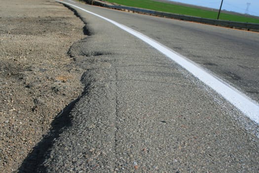 Close up of a white line of a road.
