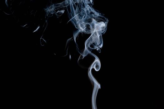 A quiet stream of smoke rising