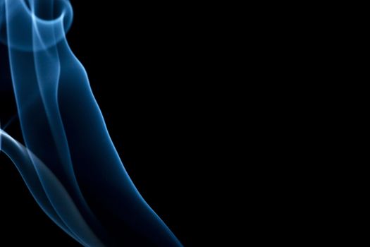 A cool blue smoke background on black