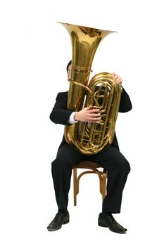 man sitting on a chair and plays the tuba