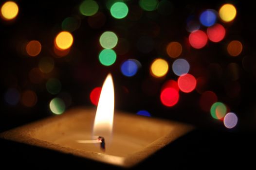 candle lit with colorful background