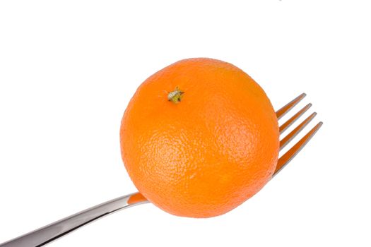 tangerine on a fork over white background