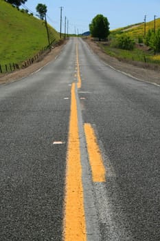 Long infinite road on a sunny day.
