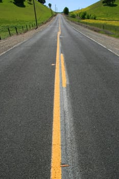 Long infinite road on a sunny day.
