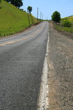 Long infinite road on a sunny day.
