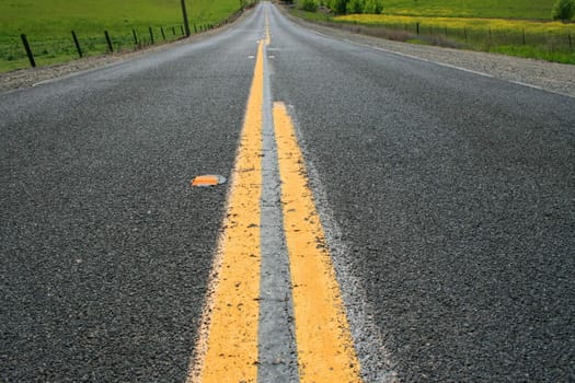 Long infinite road on a sunny day.
