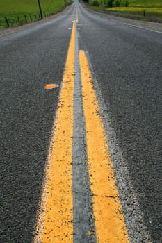 Long infinite road on a sunny day.
