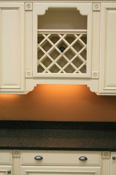 Close up of the white kitchen cabinets.
