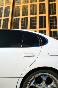 White Lexus GS with chrome rims and tinted windows.
