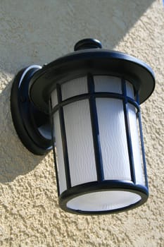 Close up of an outdoor light fixture.
