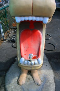 Close up of a lion statue drinking fountain.
