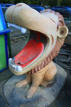 Close up of a lion statue drinking fountain.
