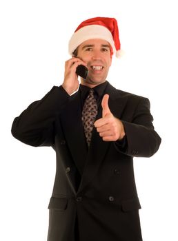 Businessman giving the thumbs up sign while talking on a cell phone