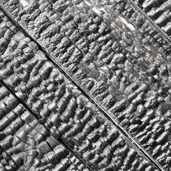 Wooden wall blackened after the fire - the texture