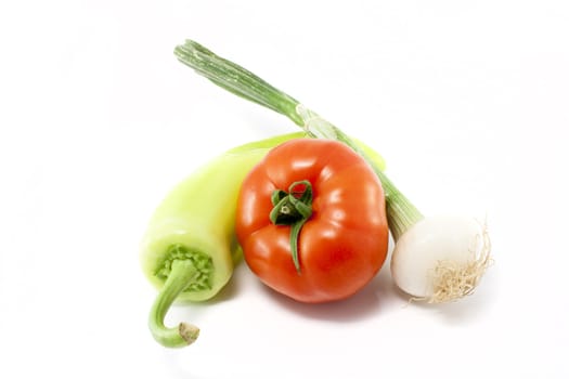 Tomato, onion and pepper, isolated on white background.