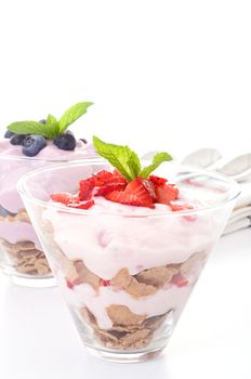 Fruit parfait with strawberries and yogurt and granola.