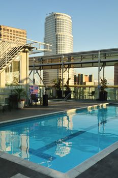 Rooftop swimming pool has a skyscraper view