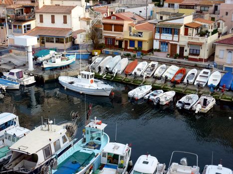 View of houses and small boats aligned at the port of Vallon des Auffes, Marseilles, France