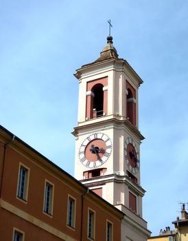 Colored bell tower with clock at Nice, France, by beautiful weather