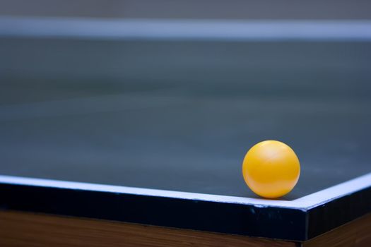 Ping pong ball lying in the corner of the table