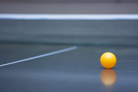 Ping pong ball lying in the corner of the table