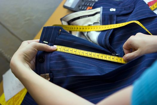 Tailor making measurements on trousers