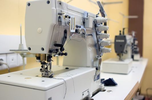 Two sewing machine on a table