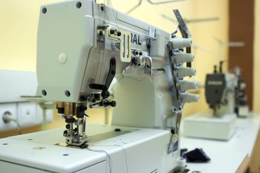 Two sewing machine on a table