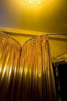 Golden curtains in the fitting room