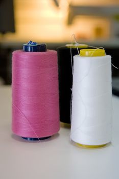 Spools of threads standing on the table